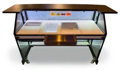 Signature 62 Mobile Portable Bar with Hybrid Bar Top - Bartender Layout Bartender workspace view of the Signature 62 mobile portable bar featuring the black hybrid bar top, stainless steel speed rail, central drop-in ice bin, and metal prep bins.