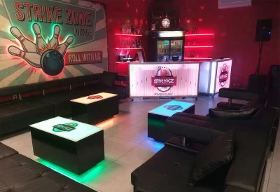 Complete Branded Venue Setup: Custom LED Portable Bars and Cubix Lounge Tables.