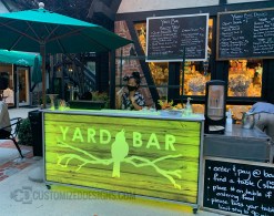 62" Outdoor Satellite Bar - Wood Background 62" Outdoor Satellite Bar - Wood Background