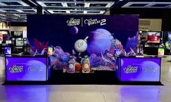 Modular exhibition display system with illuminated counters and custom branded backdrop for retail promotions 5-hour Energy video game promotional booth with Signature 62 LED-backlit counters at gaming convention