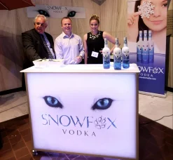Fusion 48 portable bar with LED backlit branding for spirits tastings and promotional events Portable branded bar setup for Snowfox Vodka tasting and sampling event