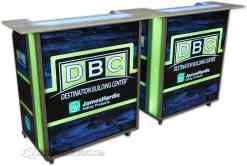 Mobile Mini Portable Bars - DBC Branding with Wrap Style Tops Two Mobile Mini portable bars with green LED lighting and DBC Destination Building Center branding featuring wrap style bar tops